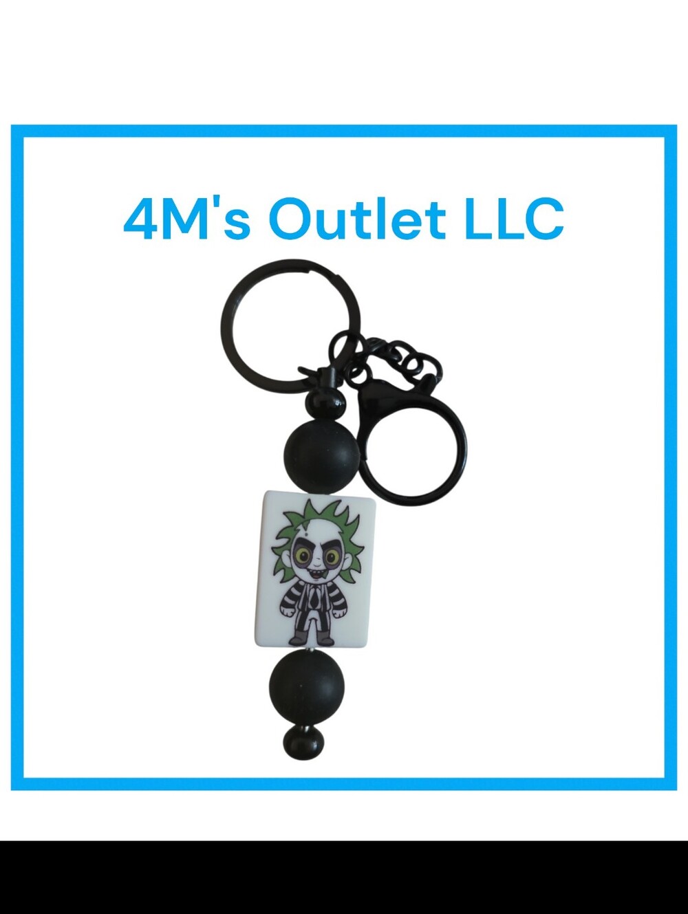 Source Unknown Black and White Character Keychain with Green Accent